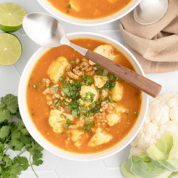 Chili-Spiced Pumpkin Soup with Pork, Cauliflower, Cilantro & Lime